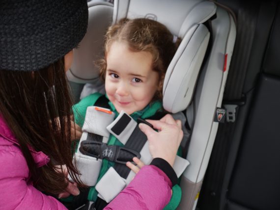 Pinch test demonstration in forward facing car seat