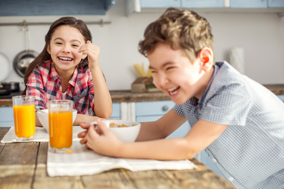 Kids laughing at breakfast