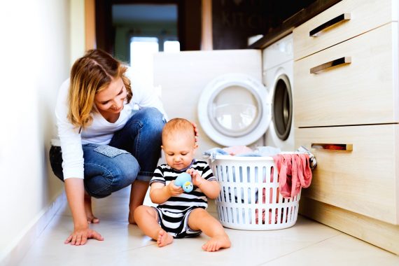 Mom and baby doing laundry